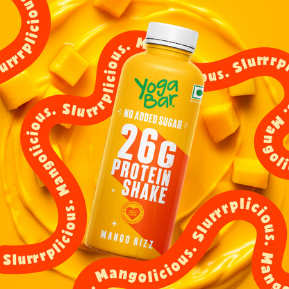 High protein mango milkshake by Yoga Bar featuring no added sugar on a bright yellow backdrop