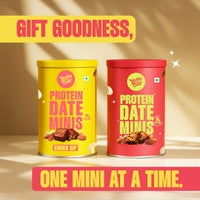 Yoga Bar healthy chocolate snack gift combo showing different variants of Protein Date Minis tins with whole almonds and cashews scattered around