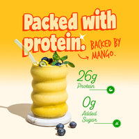 Thick mango protein smoothie glass with mint and blueberries on top highlighting 26g protein and 0g added sugar by Yoga Bar