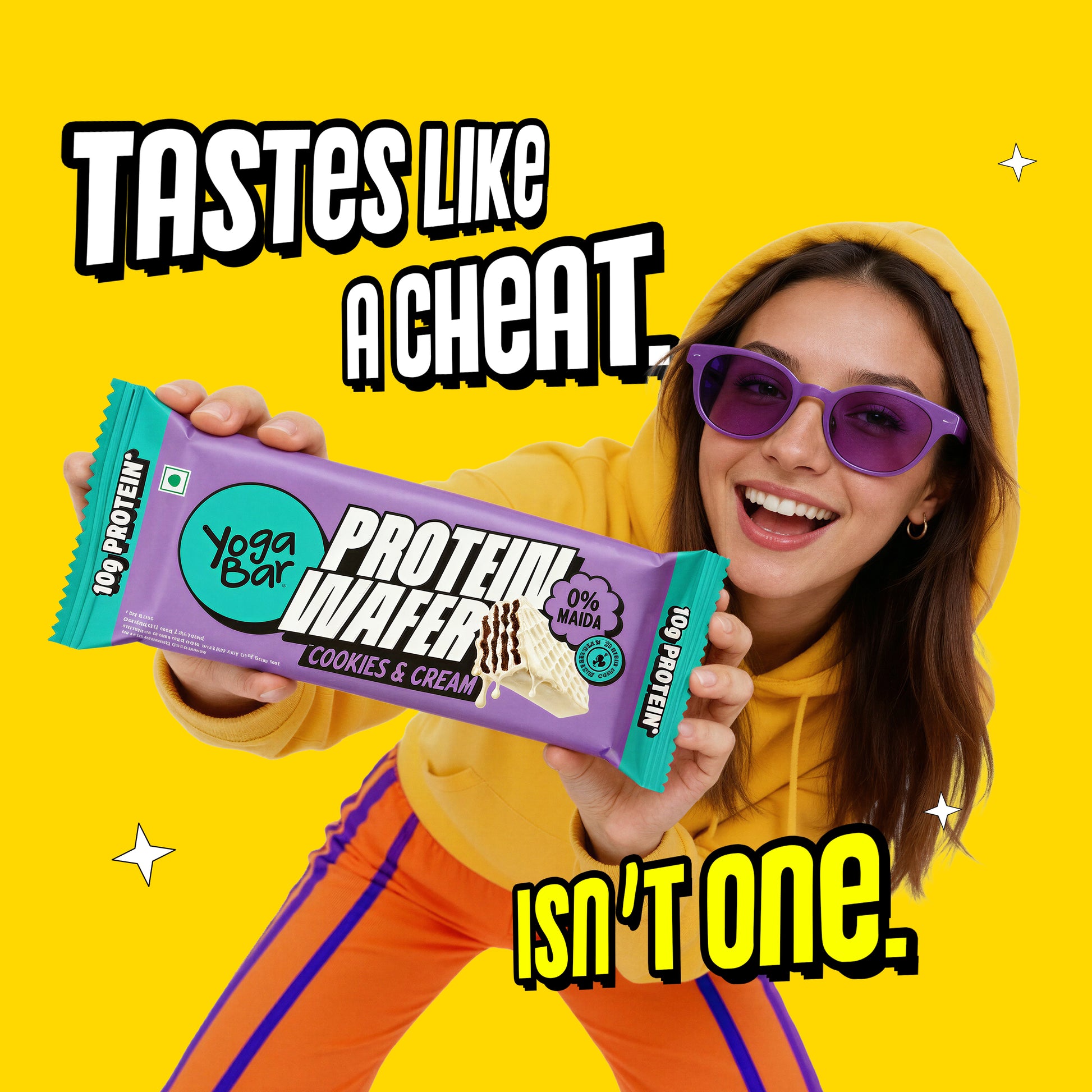 Woman holding Yoga Bar Protein Wafer Bar Cookies and Cream with 10g protein and 0% maida guilt-free healthy snack bar
