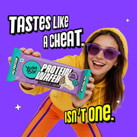 Woman holding Yoga Bar Protein Wafer Bar Cookies and Cream with 10g protein and 0% maida guilt-free crunchy snack bar